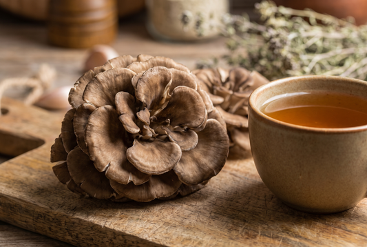 Fresh maitake mushrooms with a cup of tea
